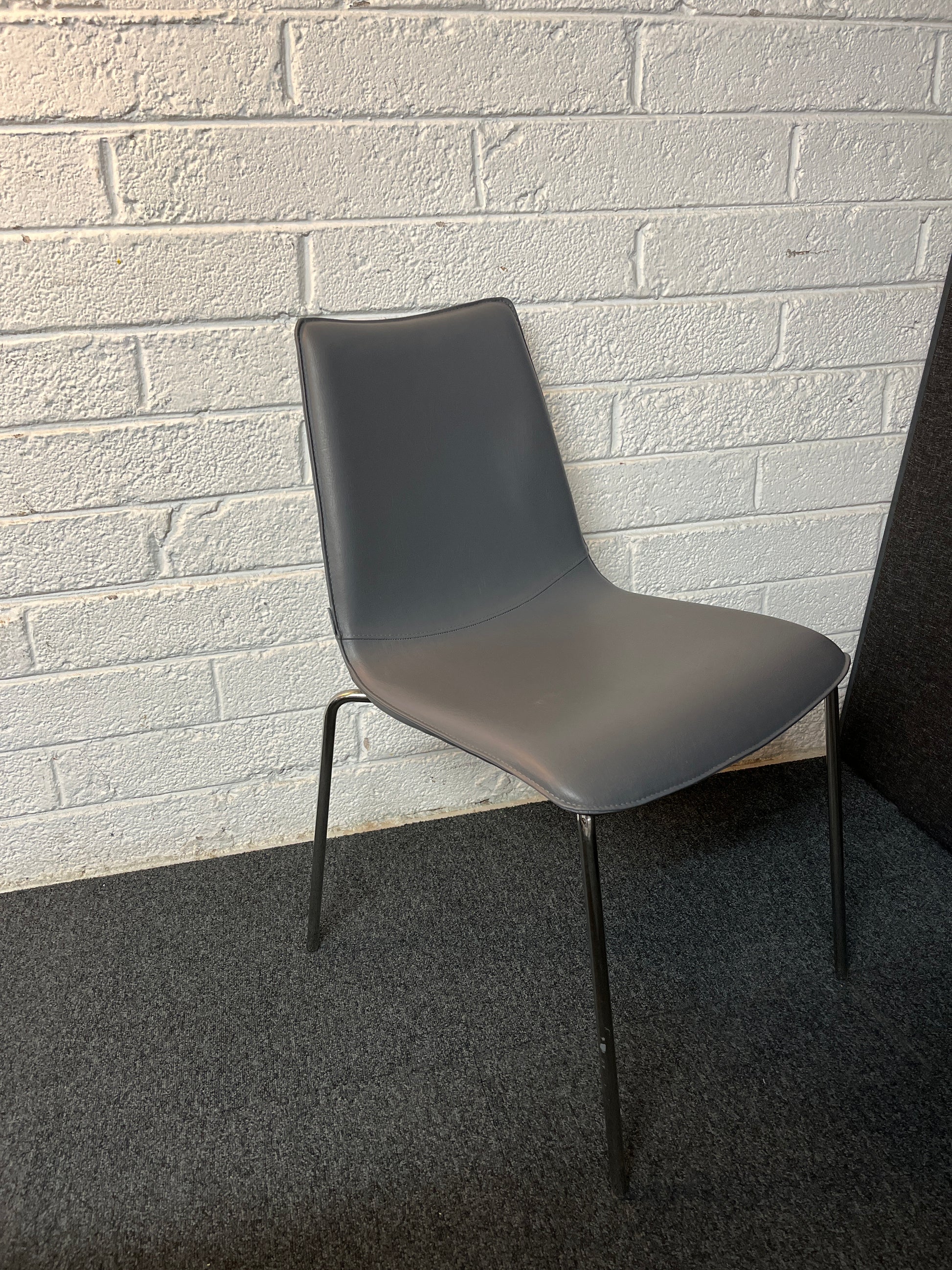 BRAND NEW Torre Italian stackable chair, chrome frame with grey leather seat and back. 4124