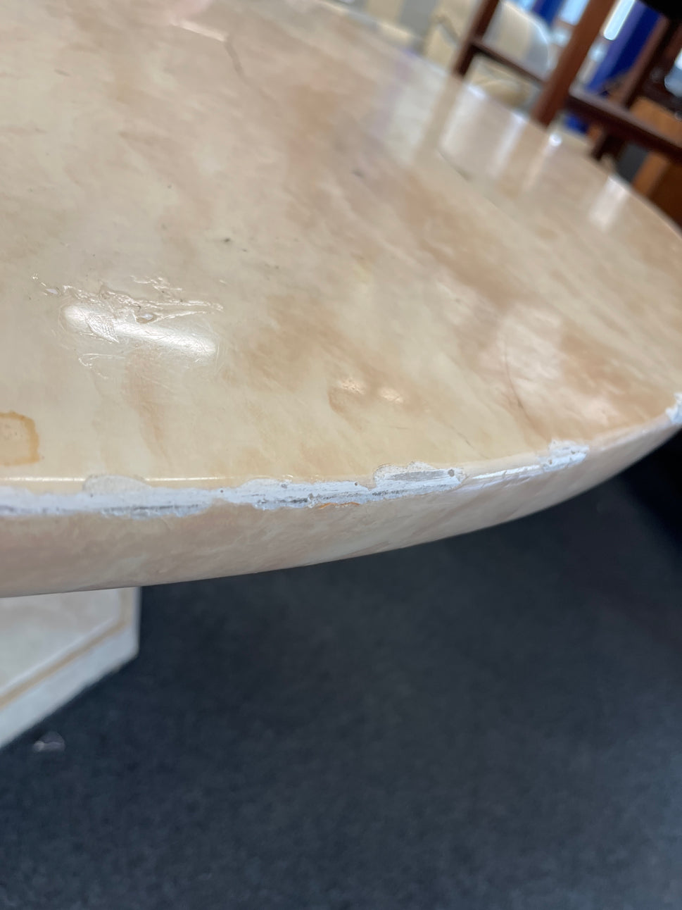 Cream marble effect circular 1300Wx760H central podium base dining table, note damage to parts of edge 2225