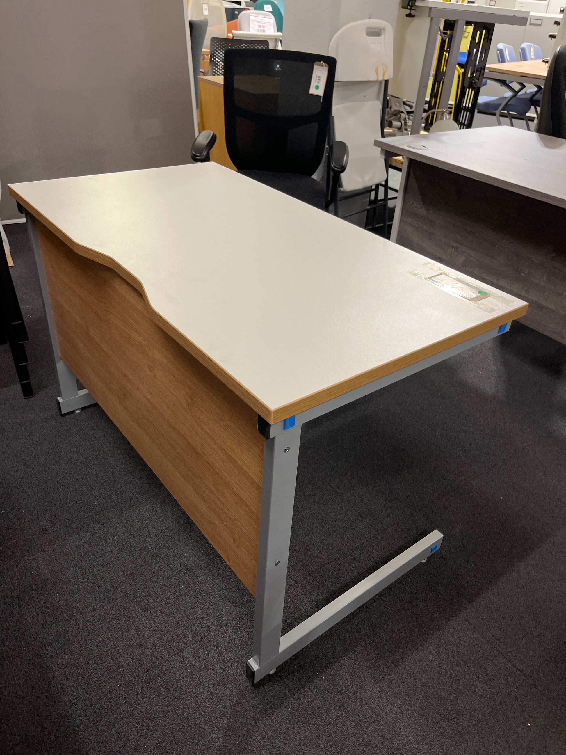 110 x 600 Straight desk with White top with oak edging and grey metal cantilever desk