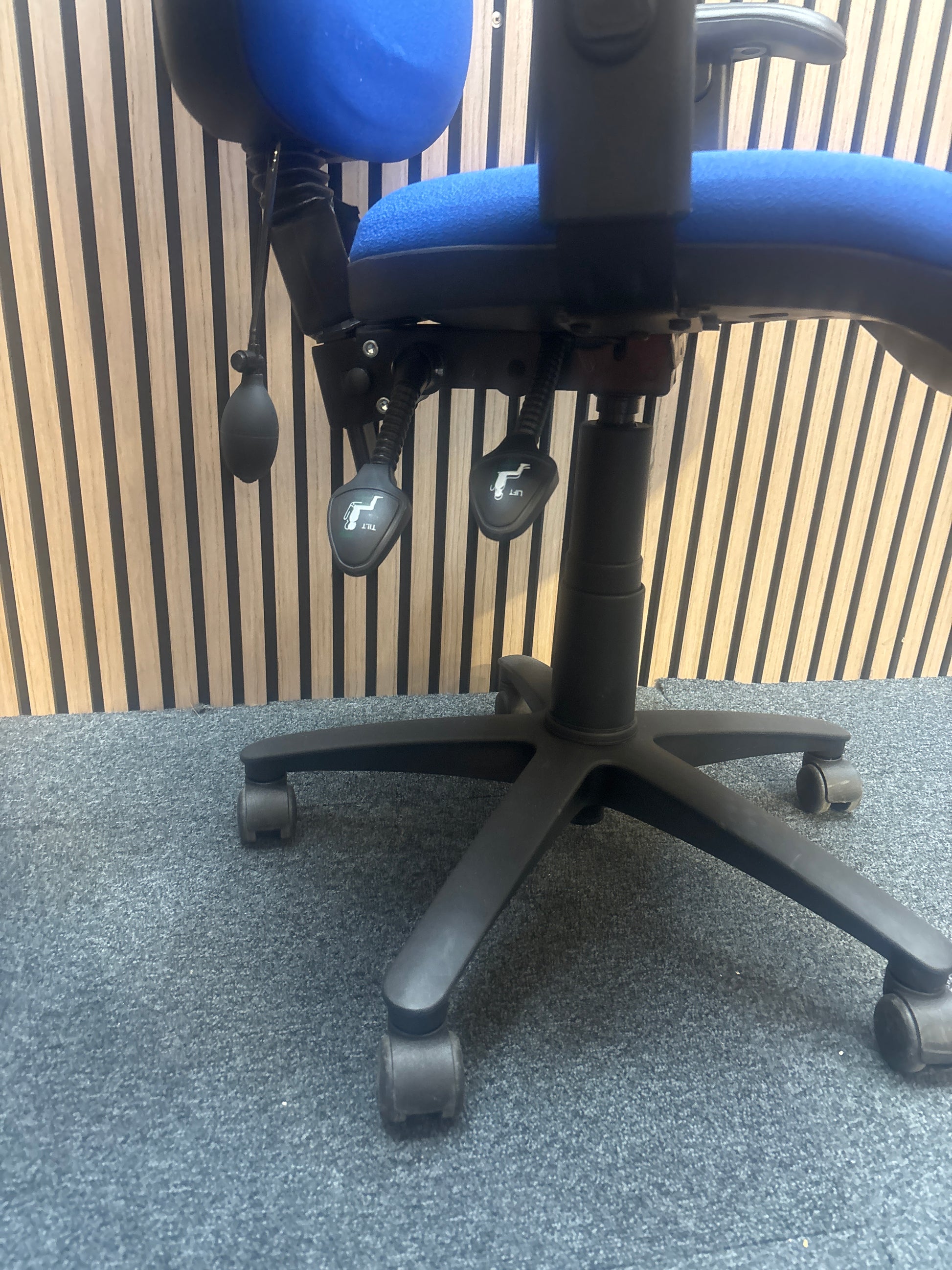 Jota medium back swivel chair in dark blue fabric with pump up lumbar support and height adjustable arms.