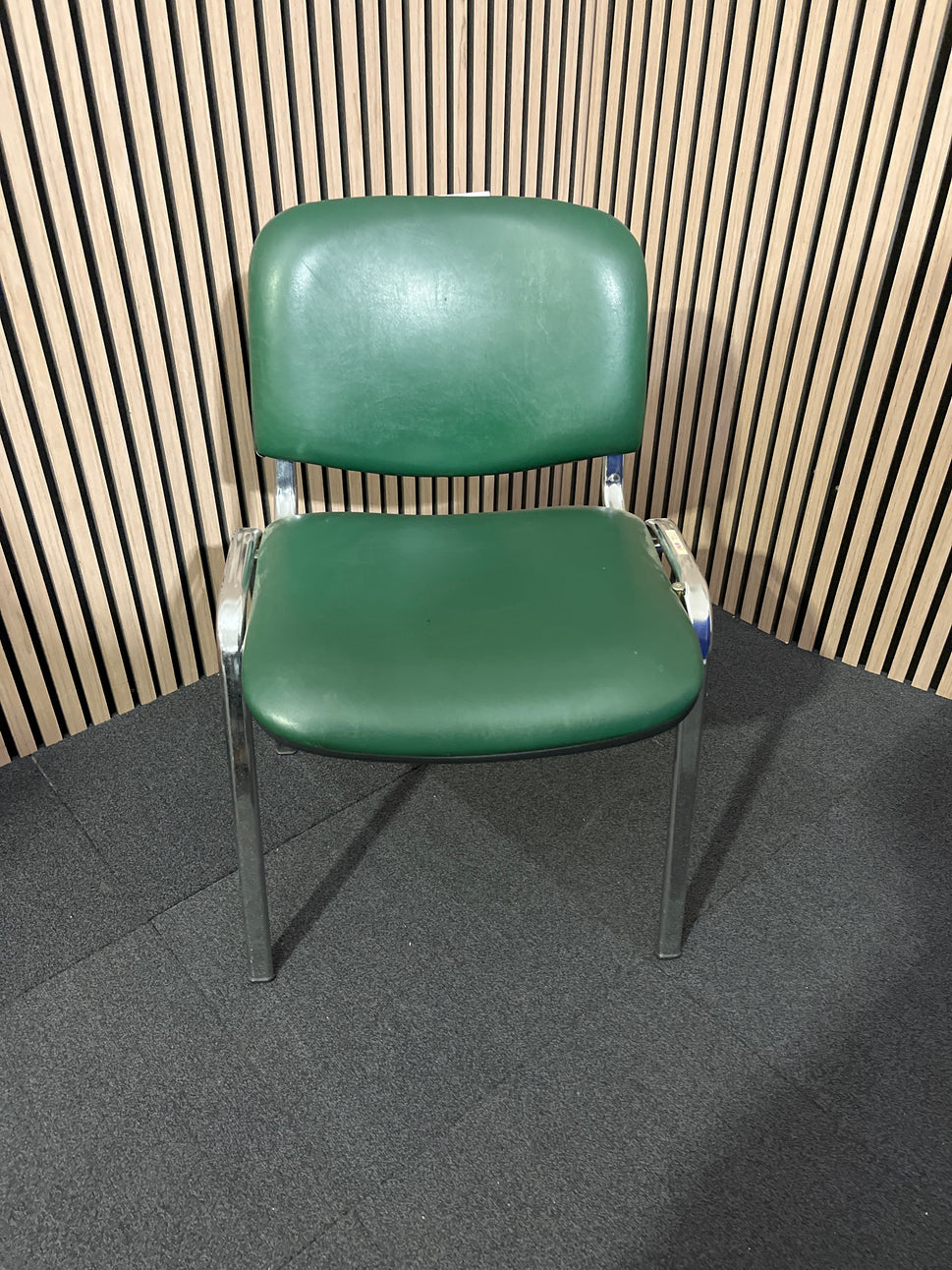 Green vinyl stacking meeting chair, chrome frame