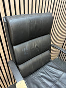 Black leatherette swivel chair with fixed arms