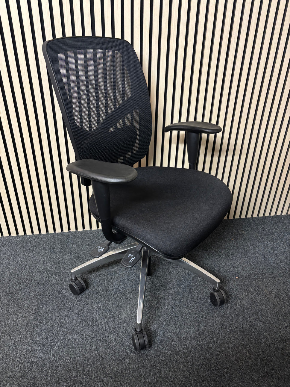 Black mesh back black fabric swivel chair with adjustable arms