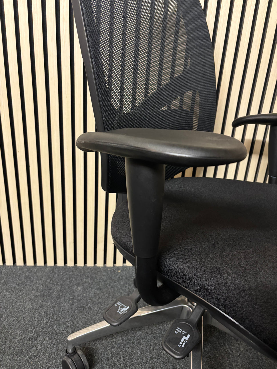 Black mesh back black fabric swivel chair with adjustable arms