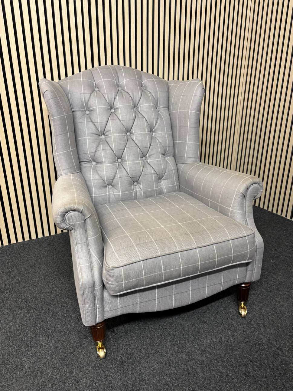 Solid wooden framed grey tartan effect fabric button back armchair on castors 2325