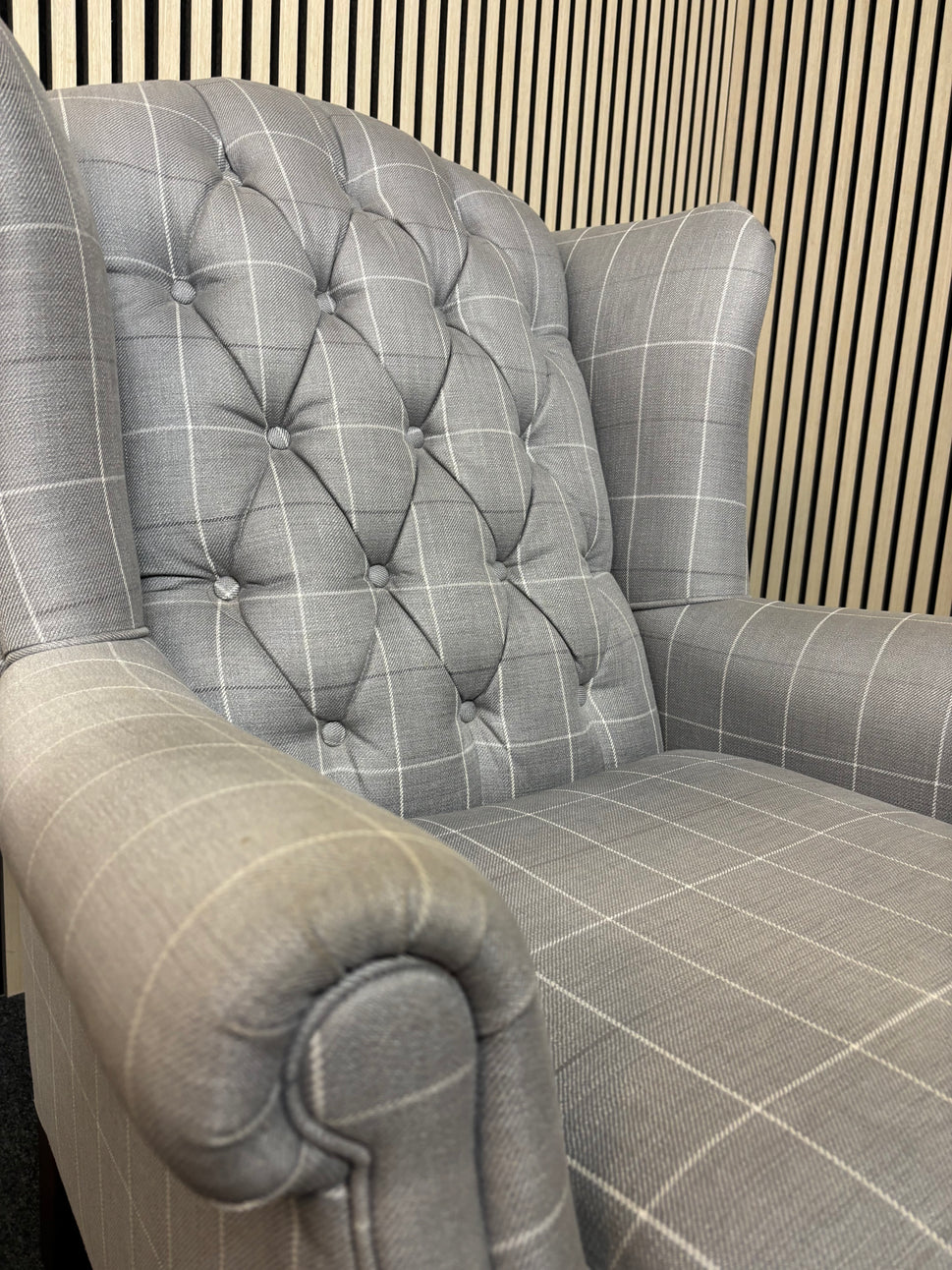 Solid wooden framed grey tartan effect fabric button back armchair on castors 2325