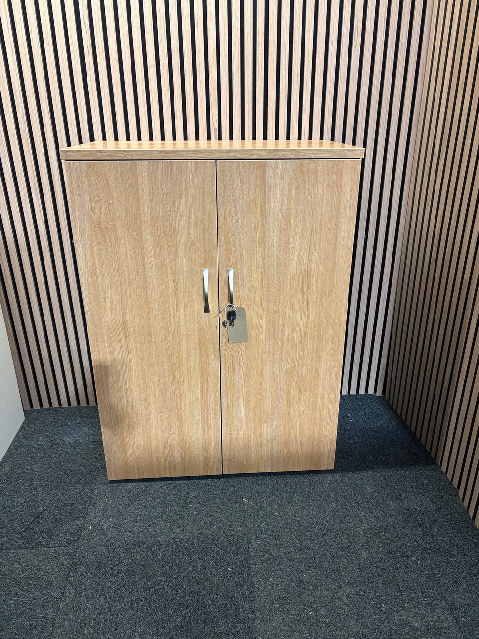 Universal 2 door storage unit in oak laminate with 2 no. internal shelves and key 1090Hx470Dx800W