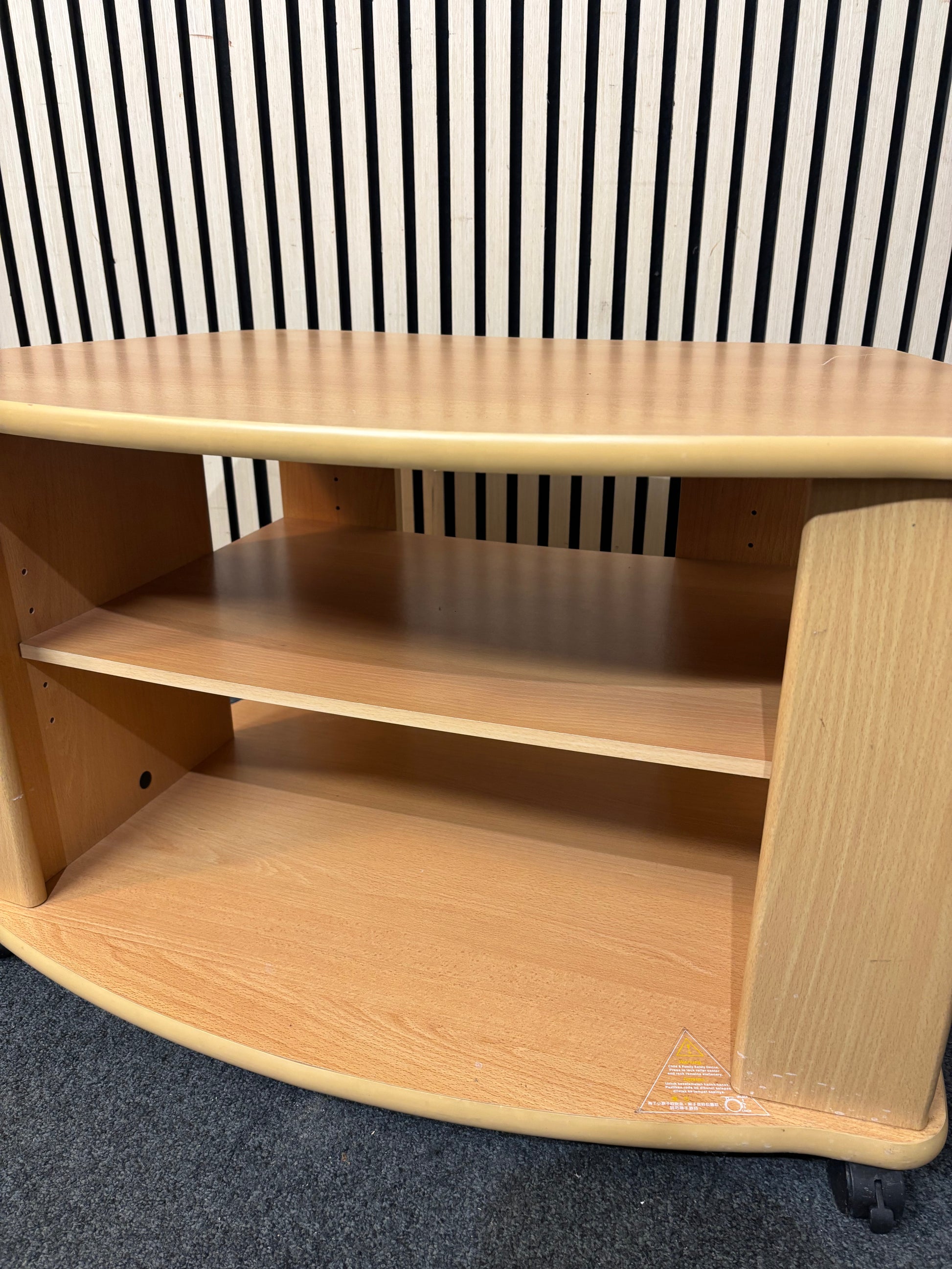 Beech laminate low TV unit on castors 3126