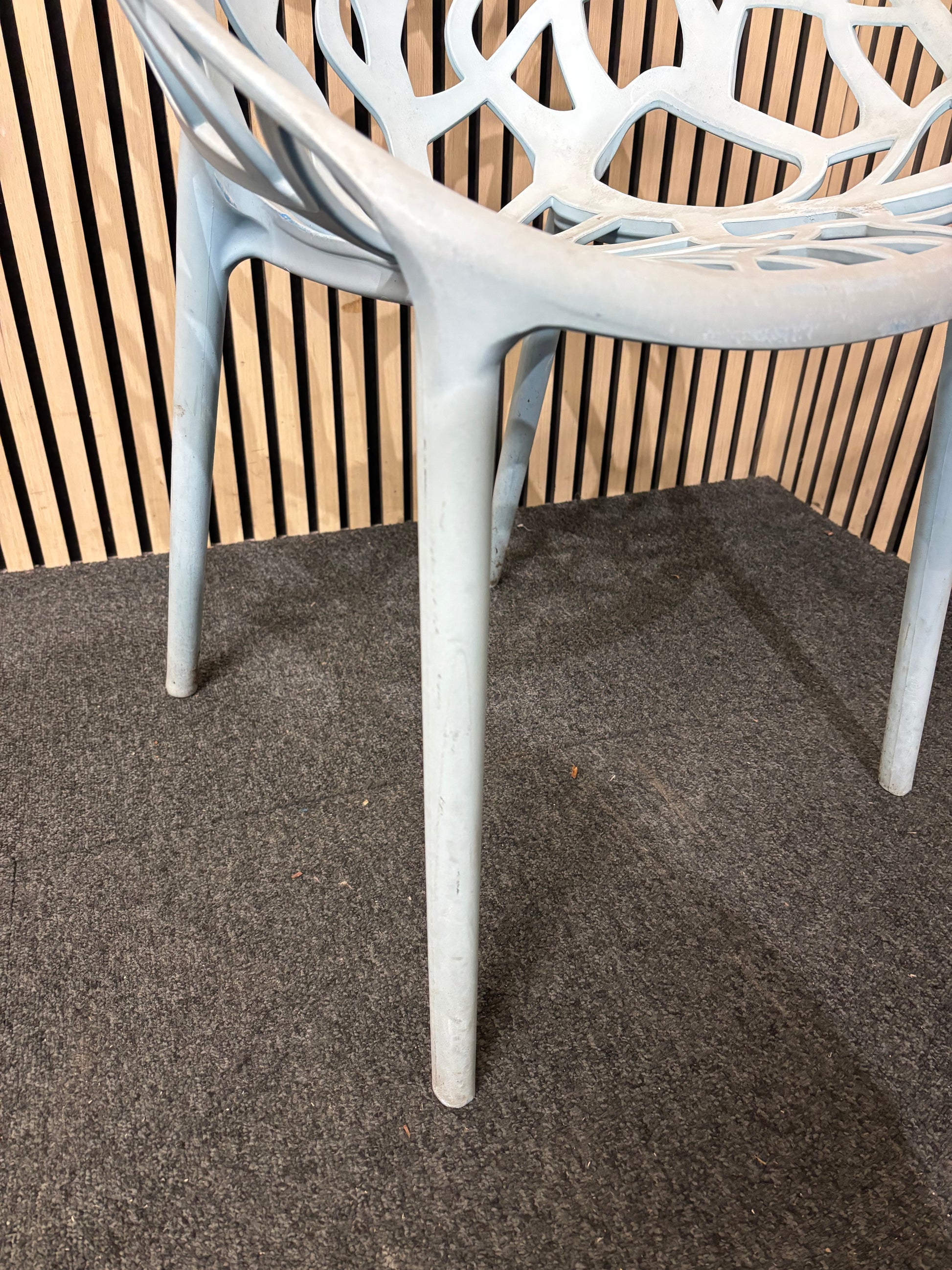Light blue stackable plastic outdoor chair - sun faded 3126