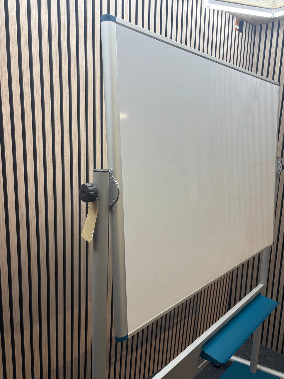 Large mobile whiteboard on castors