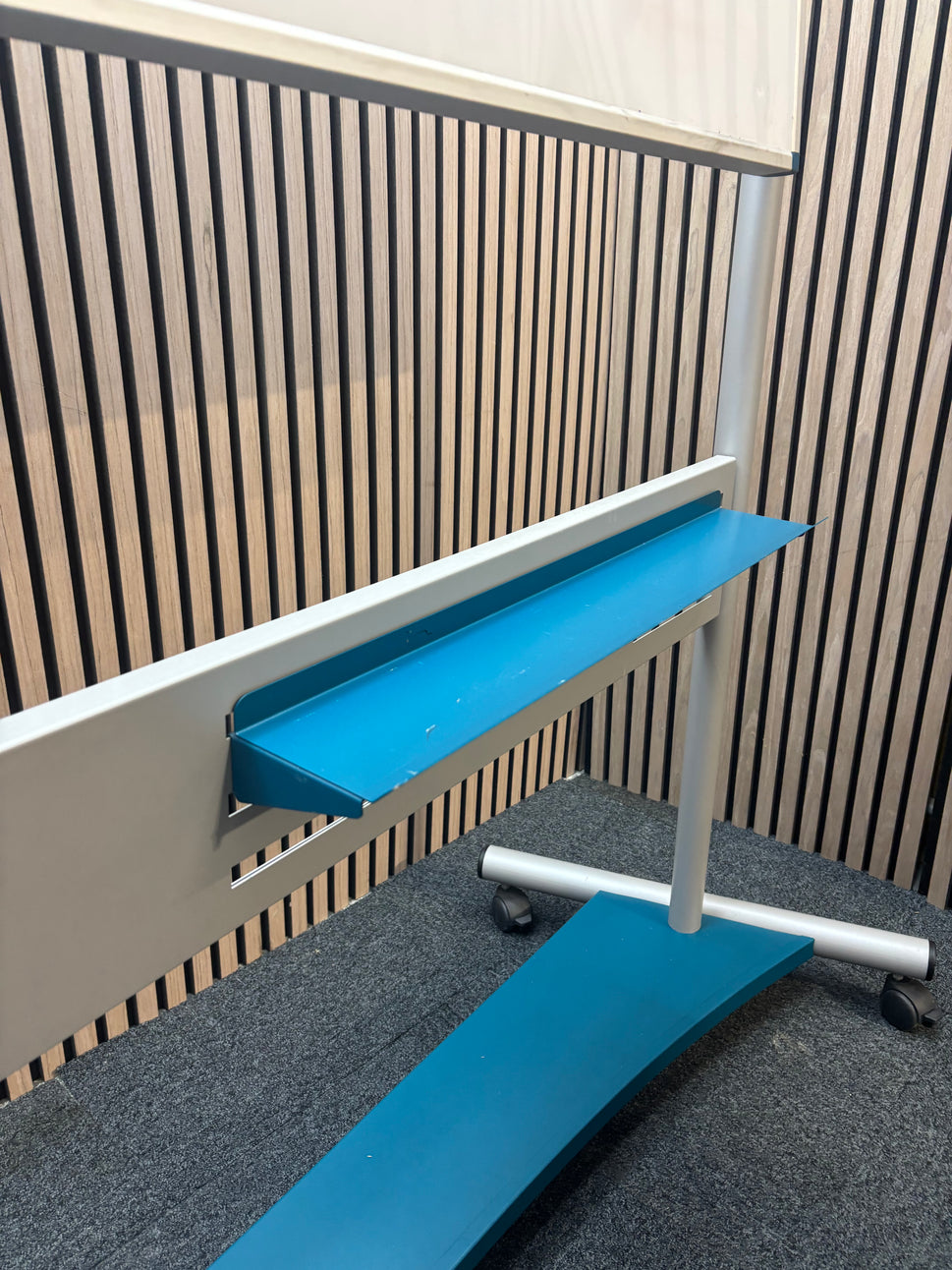 Large mobile whiteboard on castors