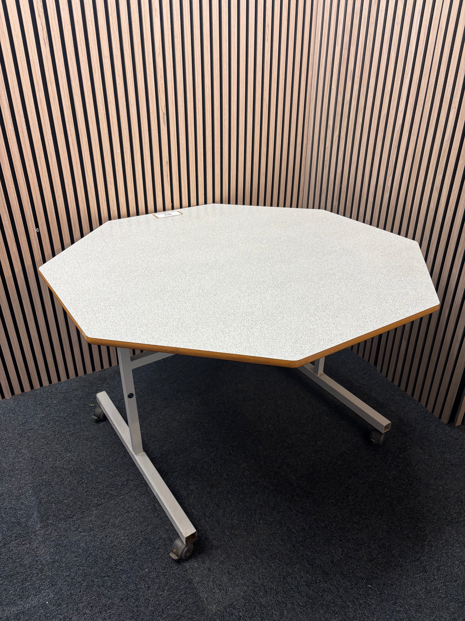 1200mm 50 pence octagonal tilt top grey formica top table on metal frame with castors. Price inc VAT
