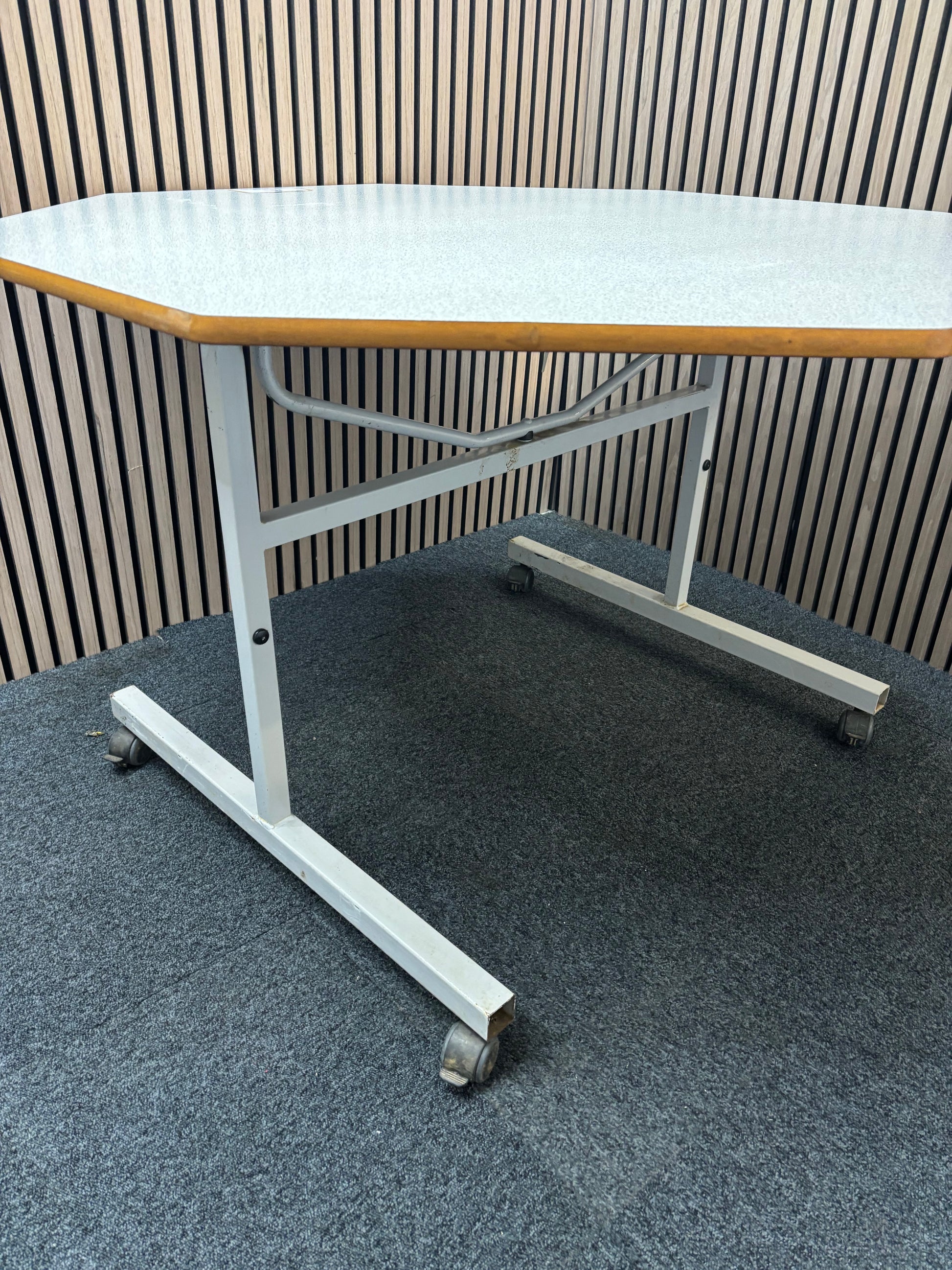 1200mm 50 pence octagonal tilt top grey formica top table on metal frame with castors. Price inc VAT