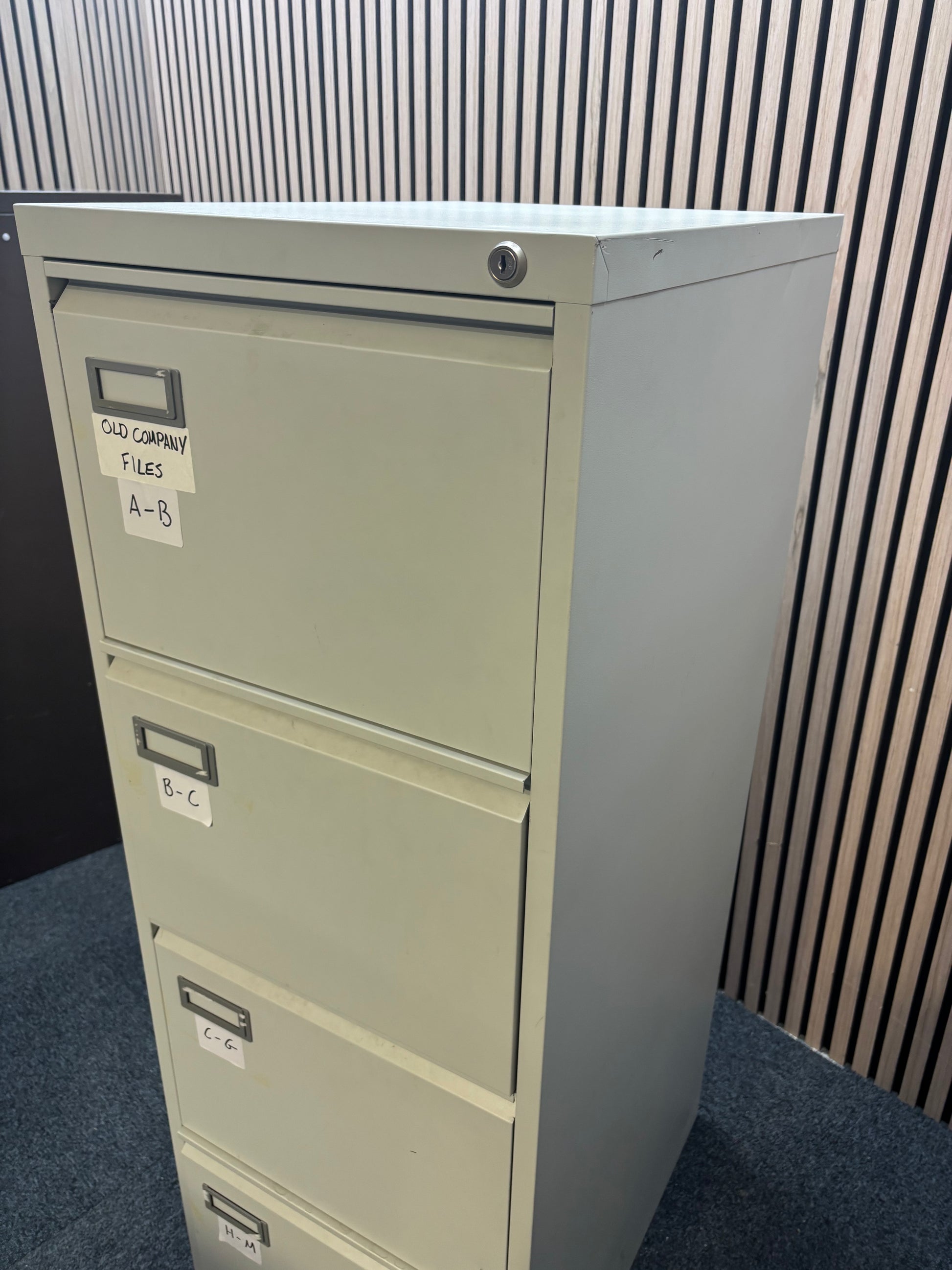 Grey metal 4 drawer filing cabinet