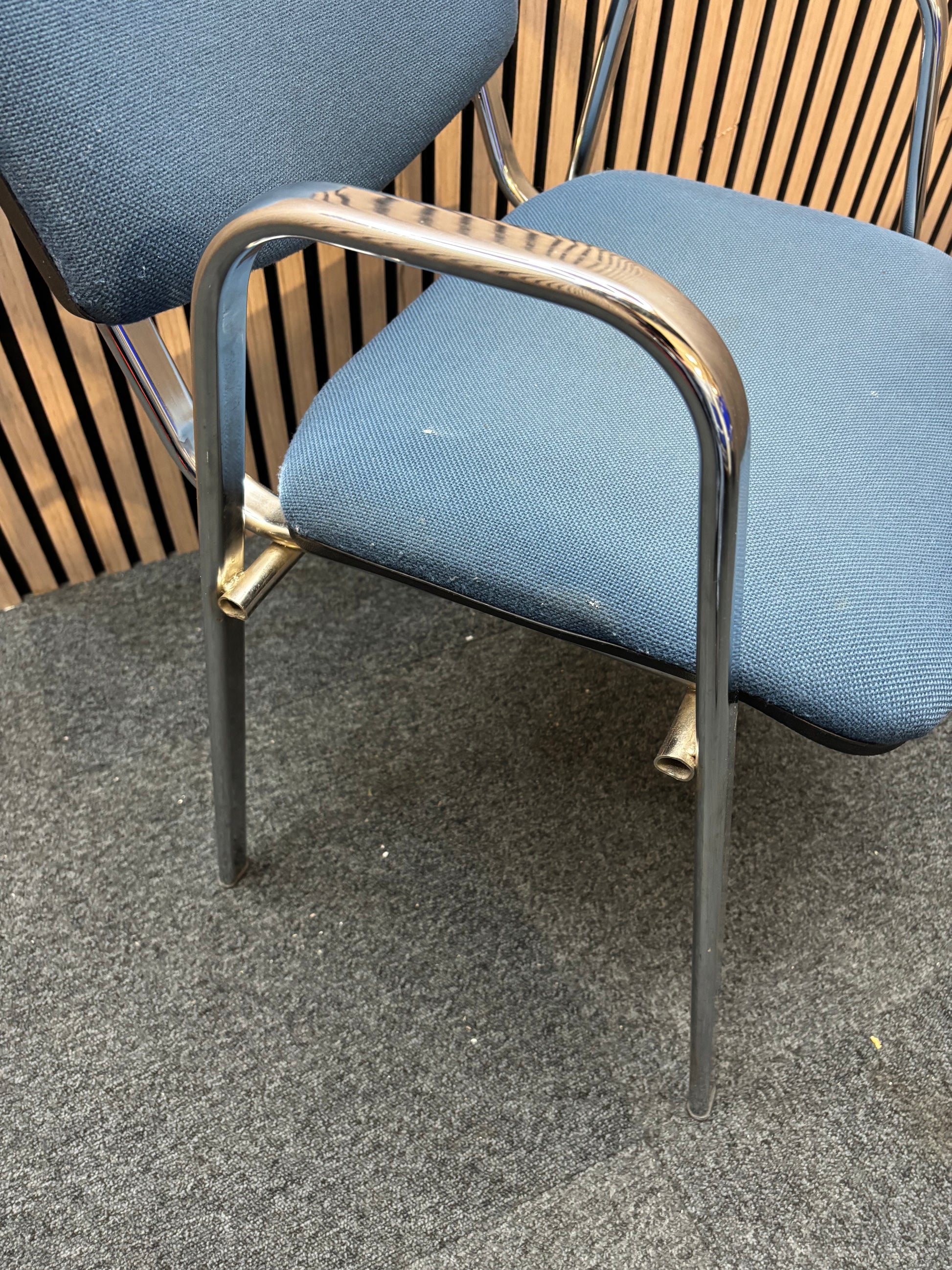 Light blue fabric chrome framed stacking chair