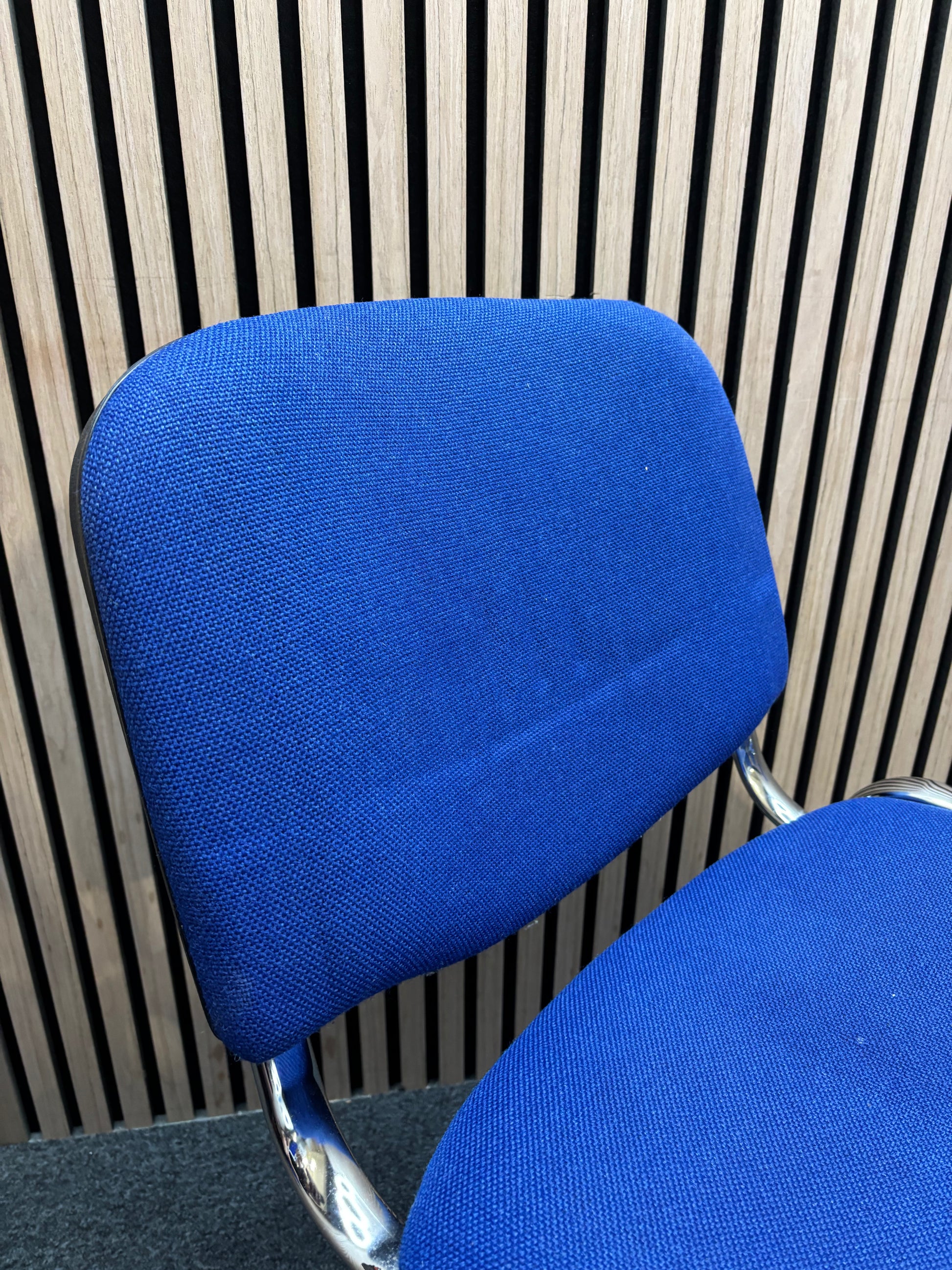 Dark blue fabric chrome framed stacking chair