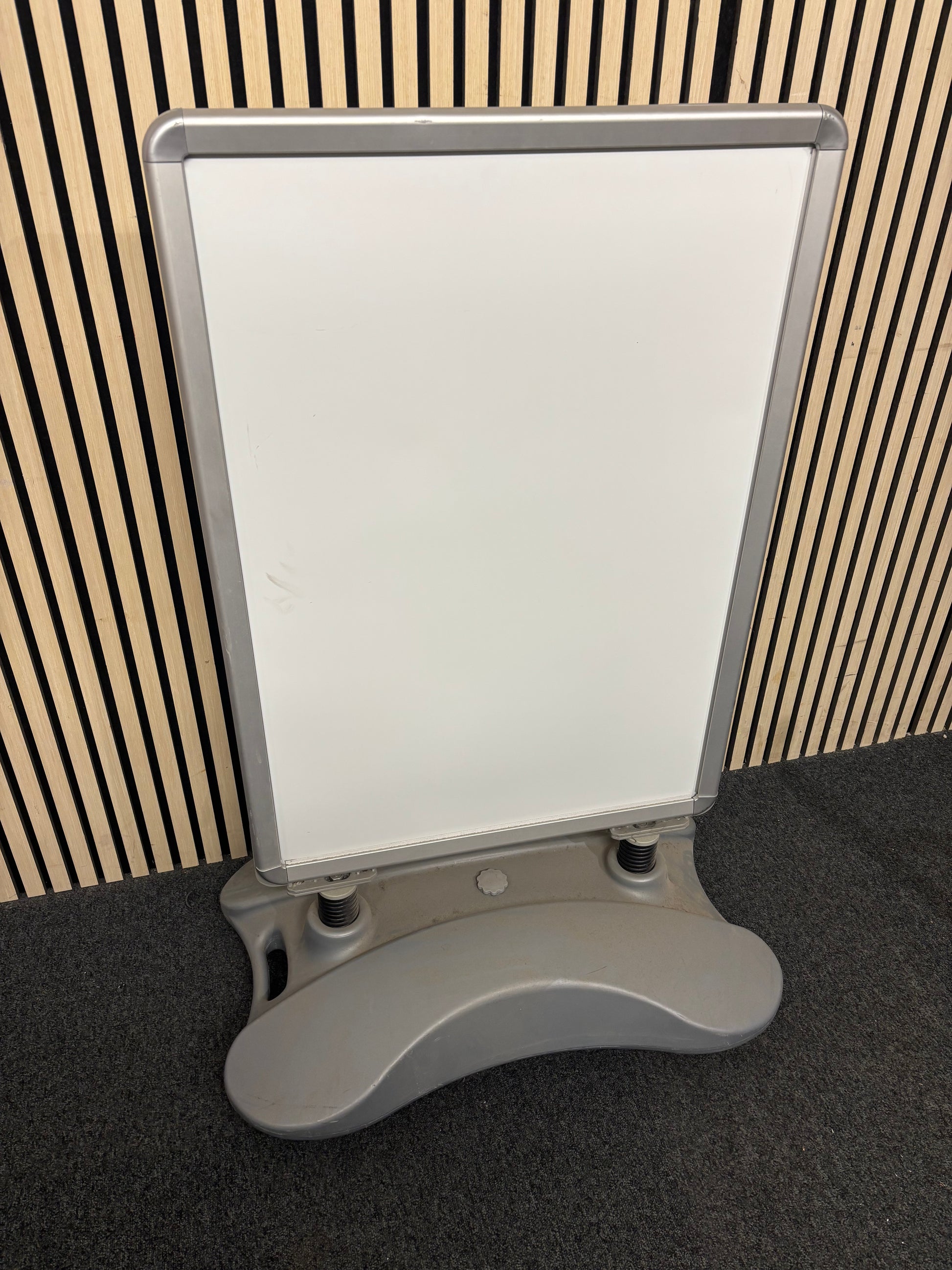 Large white plastic sandwich board on stand