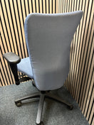Blue fabric secondhand high back swivel chair with black 5 star base and adjustable arms