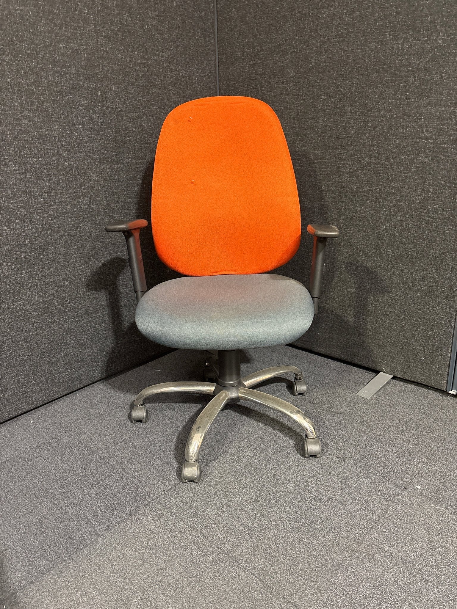 Two tone orange and grey high back swivel chair with height adjustable arms