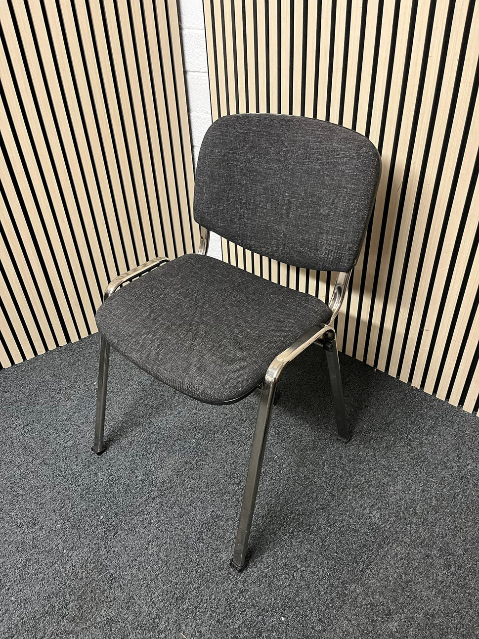 Chrome framed, charcoal fabric seat and back, stacking chair