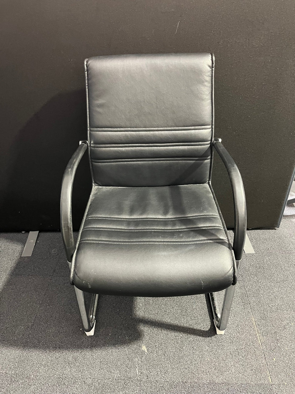 Black leather cantilever meeting chair with chrome frame