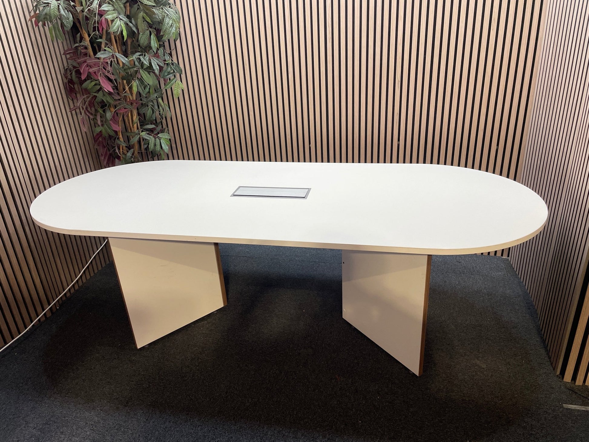 White laminate D end boardroom table 2400Lx1000W with silver trumpet base and wire management lift up cover in centre