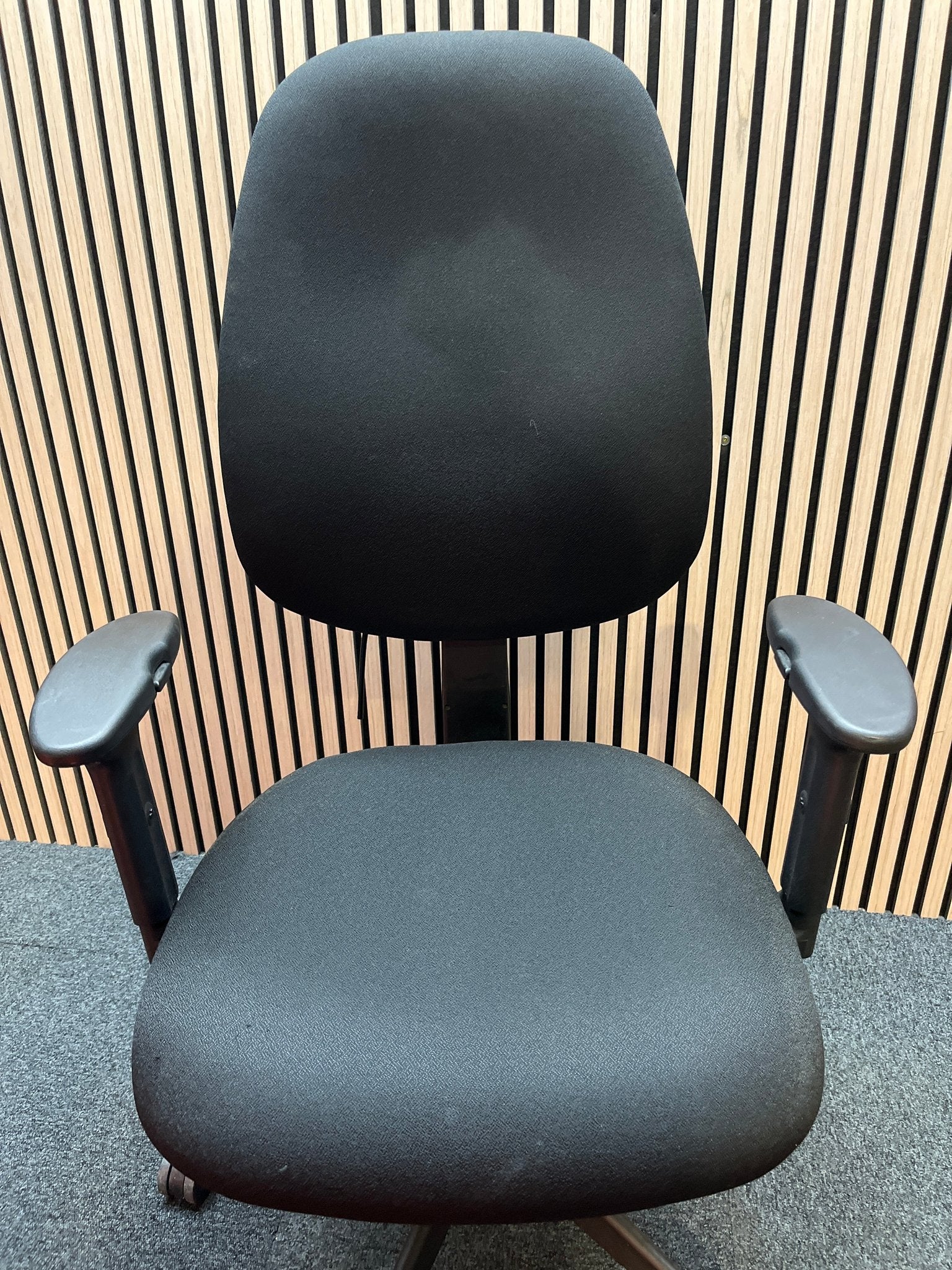 Black fabric ortho swivel
chair with adjustable arms and pump up lumbar support