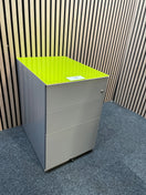 Grey metal mobile pedestal with lime green top