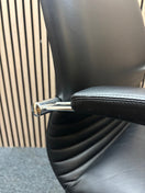 Black leatherette solid metal framed meeting chair with arms