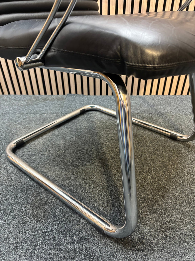 Black leatherette solid metal framed meeting chair with arms