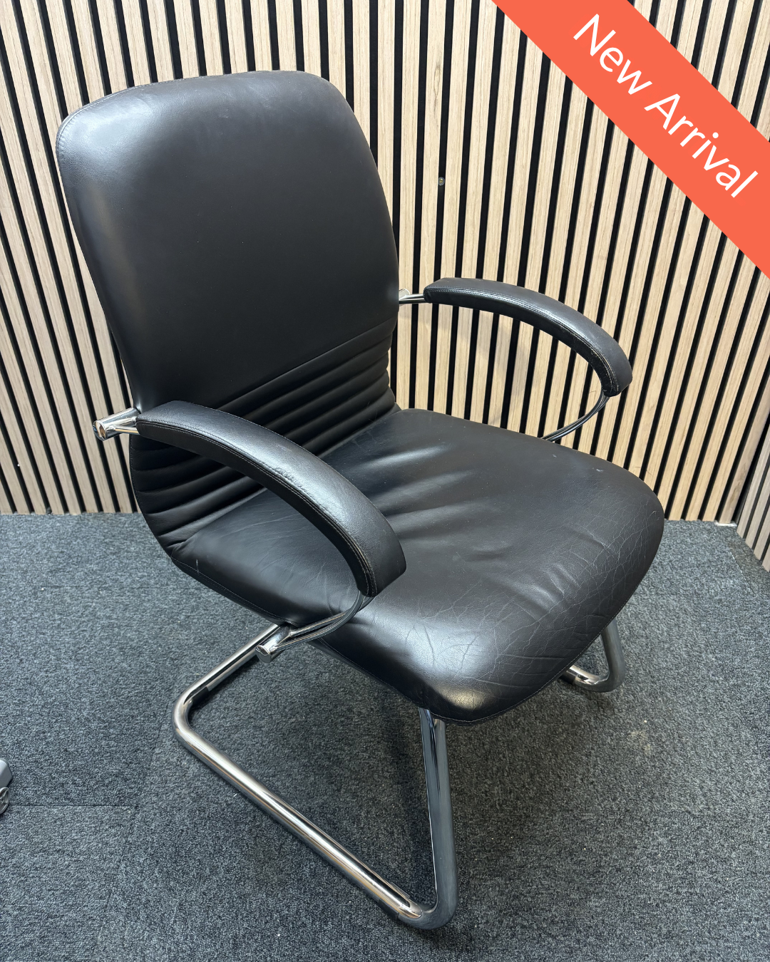 Black leatherette solid metal framed meeting chair with arms