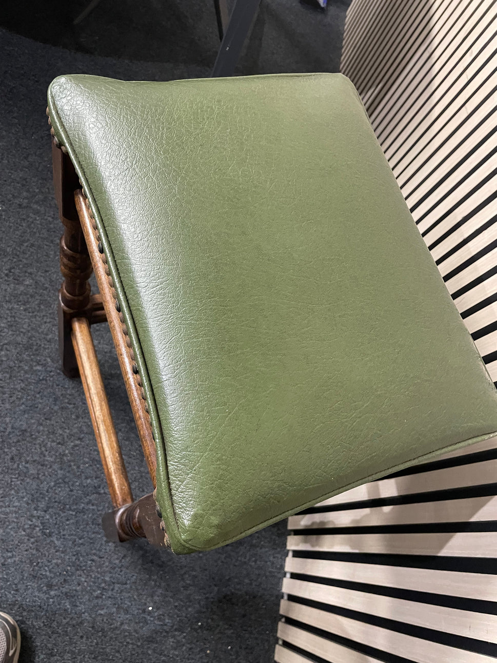 Ornate solid wooden framed high bar stool with green leatherette seat and button design 1126