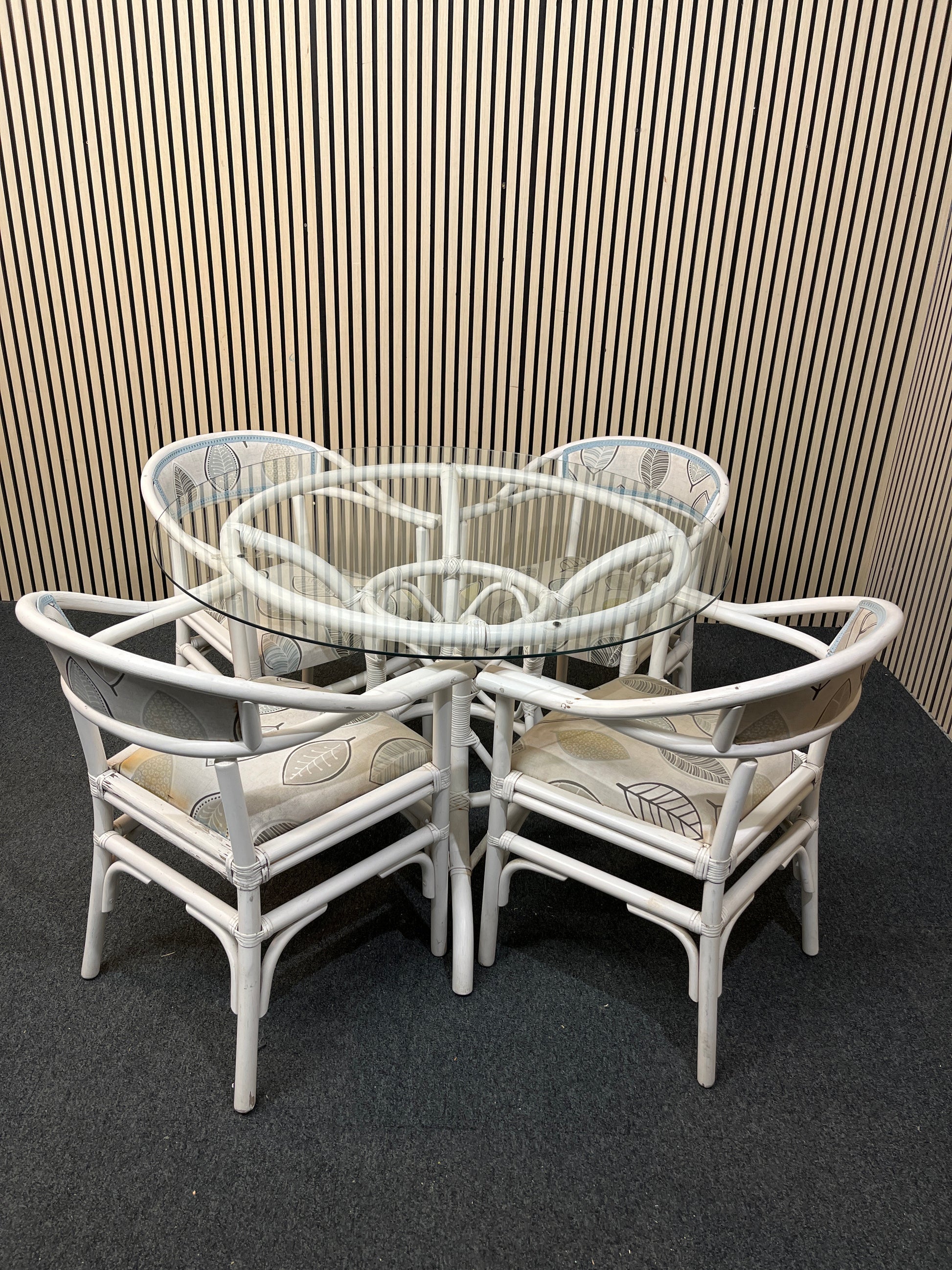 White painted cane, circular glass top conservatory table (110 cm diameter) with 4 no chairs 1126