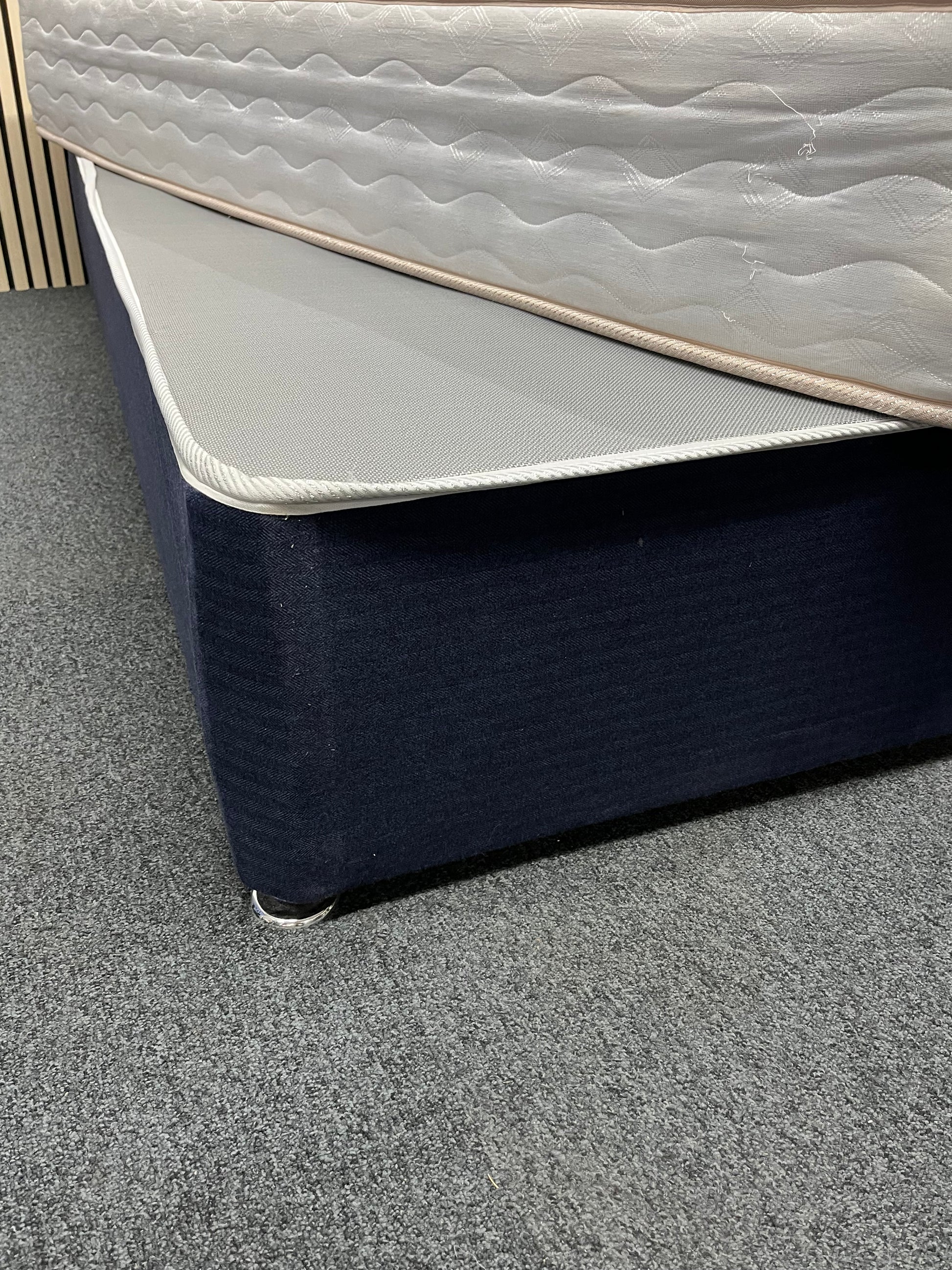 3ft secondhand divan base in navy fabric with castors