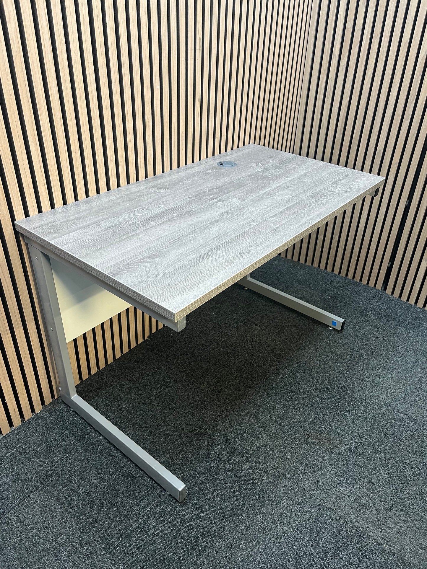 110 x 600 Straight desk  with Grey Oak finish and grey metal cantilever desk