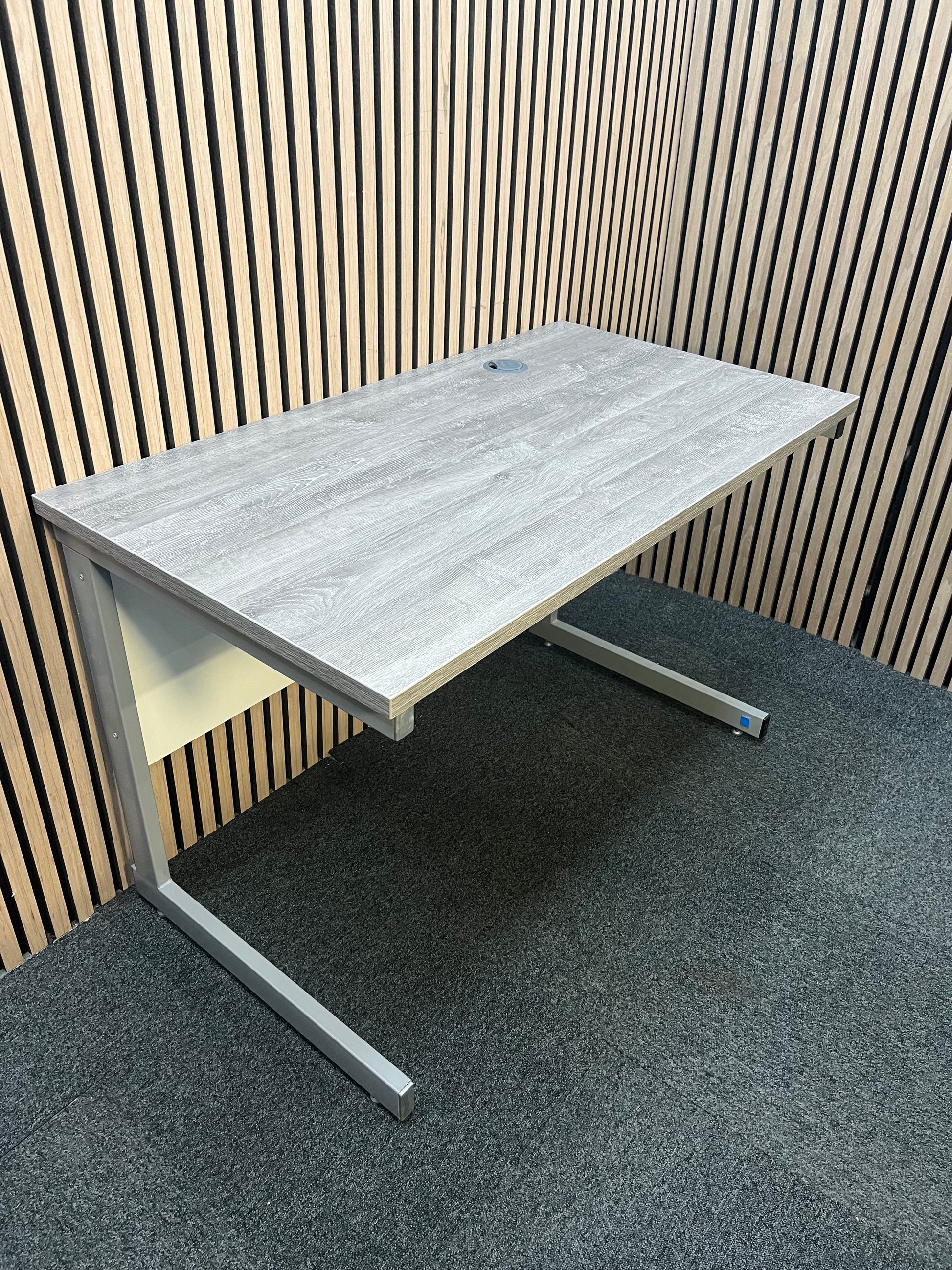 110 x 600 Straight desk  with Grey Oak finish and grey metal cantilever desk