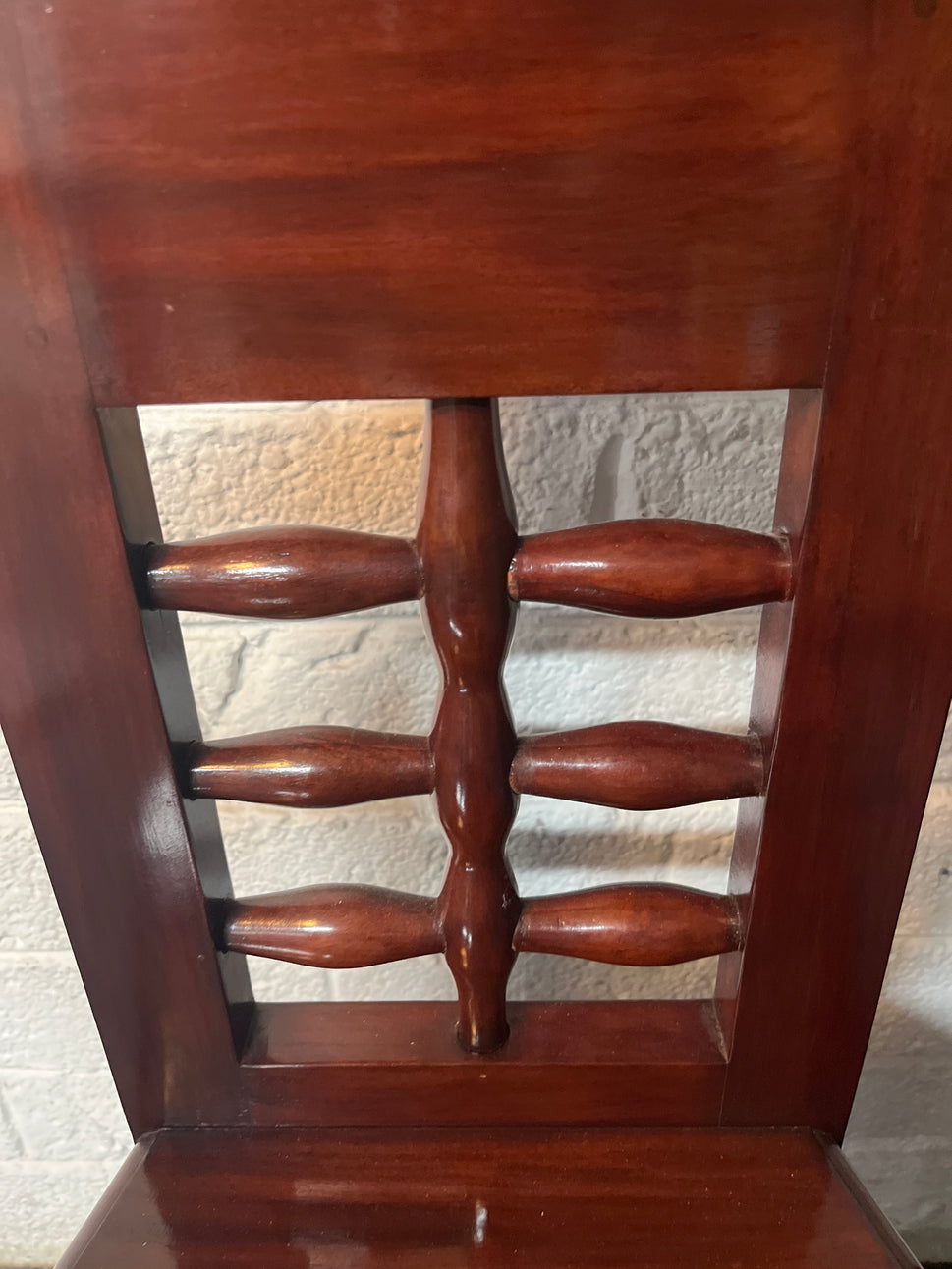 Solid teak polished stained occasional high back armchair. One arm with damage to side but repaired 2225