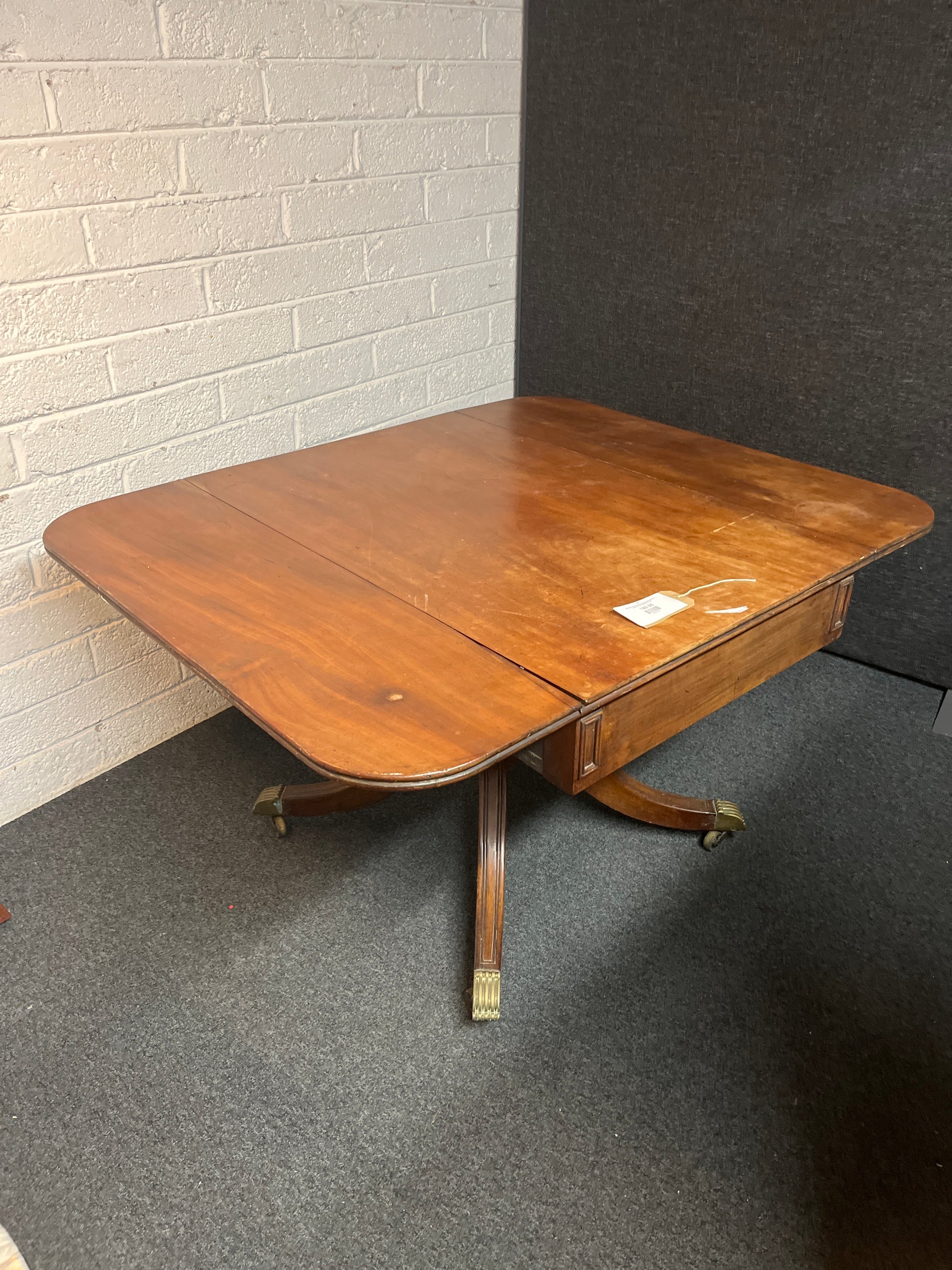 Mahogany stained ornate drop leaf dining table on castors W1270xL1250xH730 3225