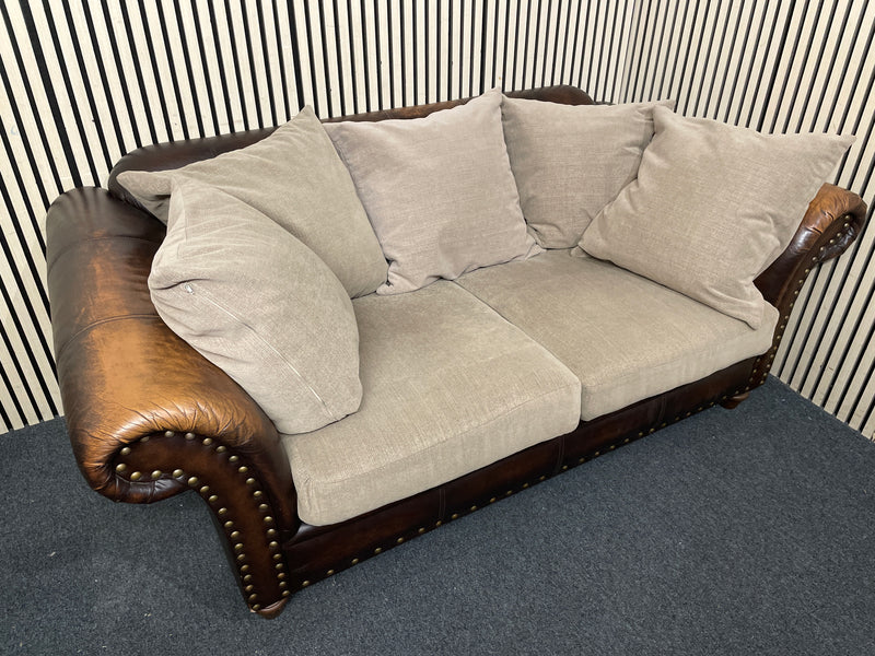 Two-seater sofa with leather frame, fabric cushions, and stud detailin W190x100D  44492