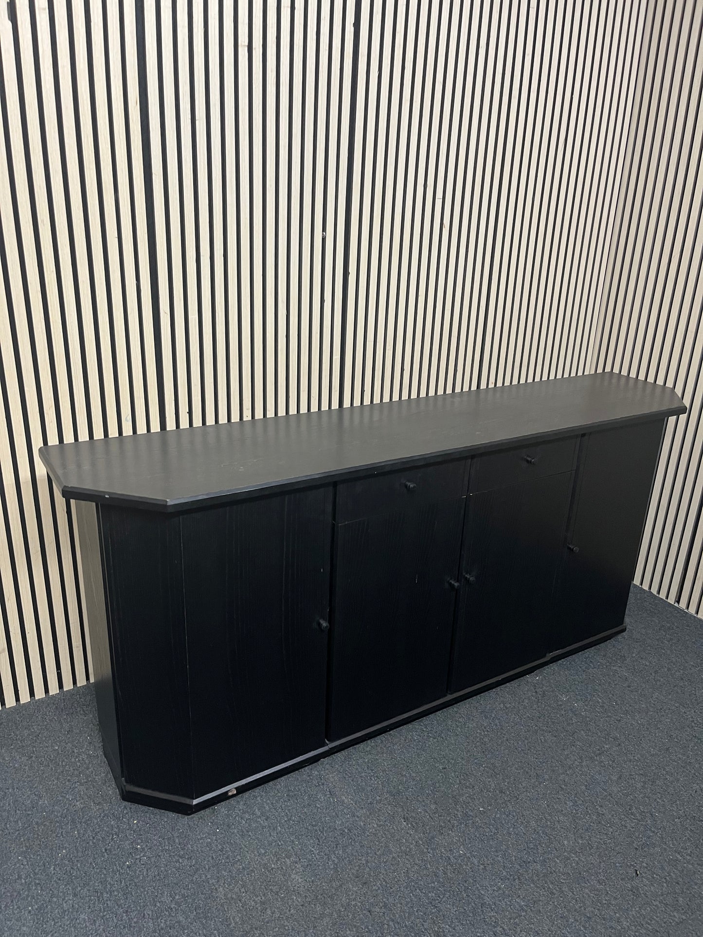 Black low sideboard with three storage doors, good condition. 44030