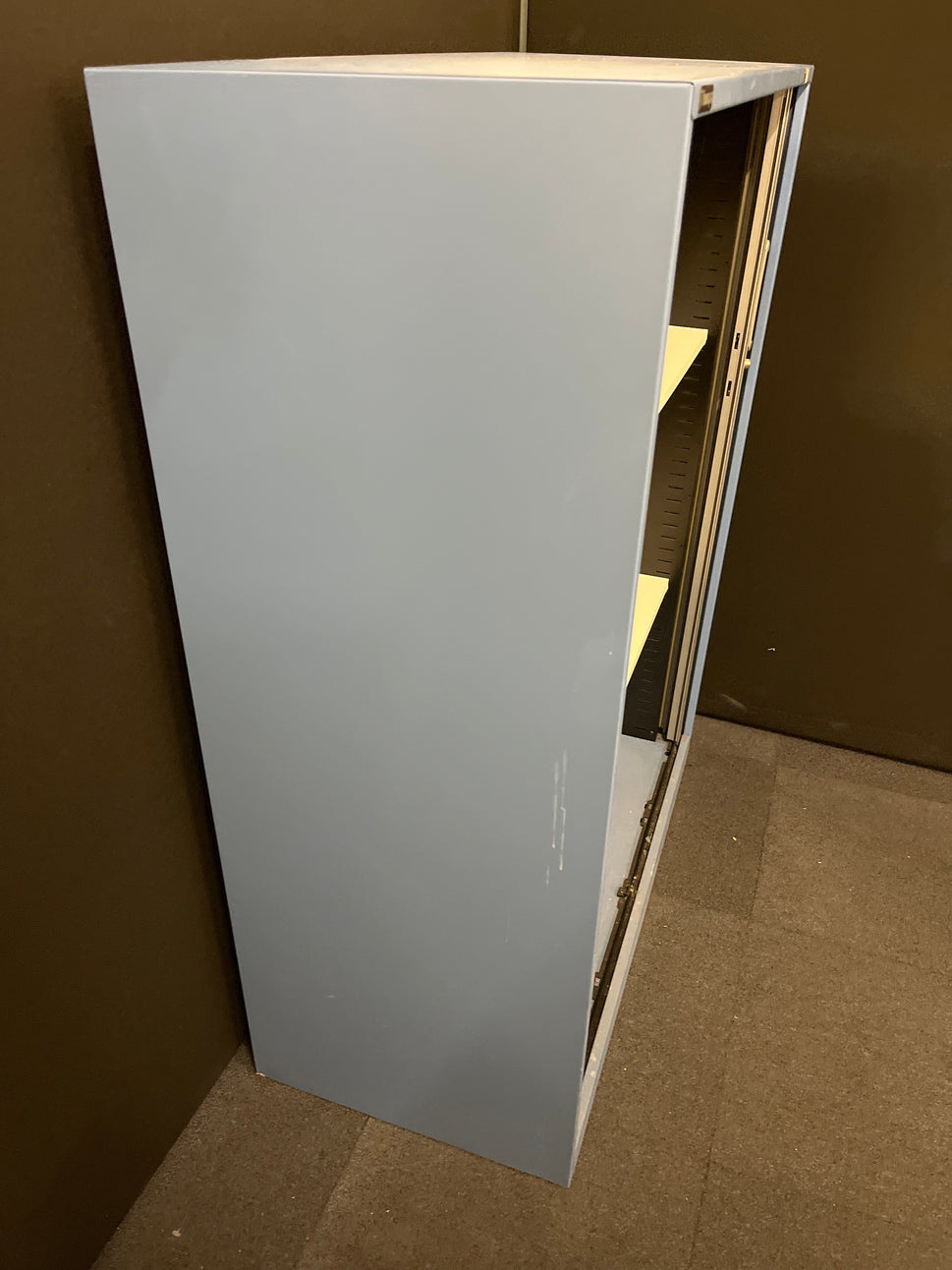 Secondhand Triumph Blue metal framed, silver plastic sliding door tambour  with 2 no. internal shelves and 1 no. key 1000Wx1290Hx475D