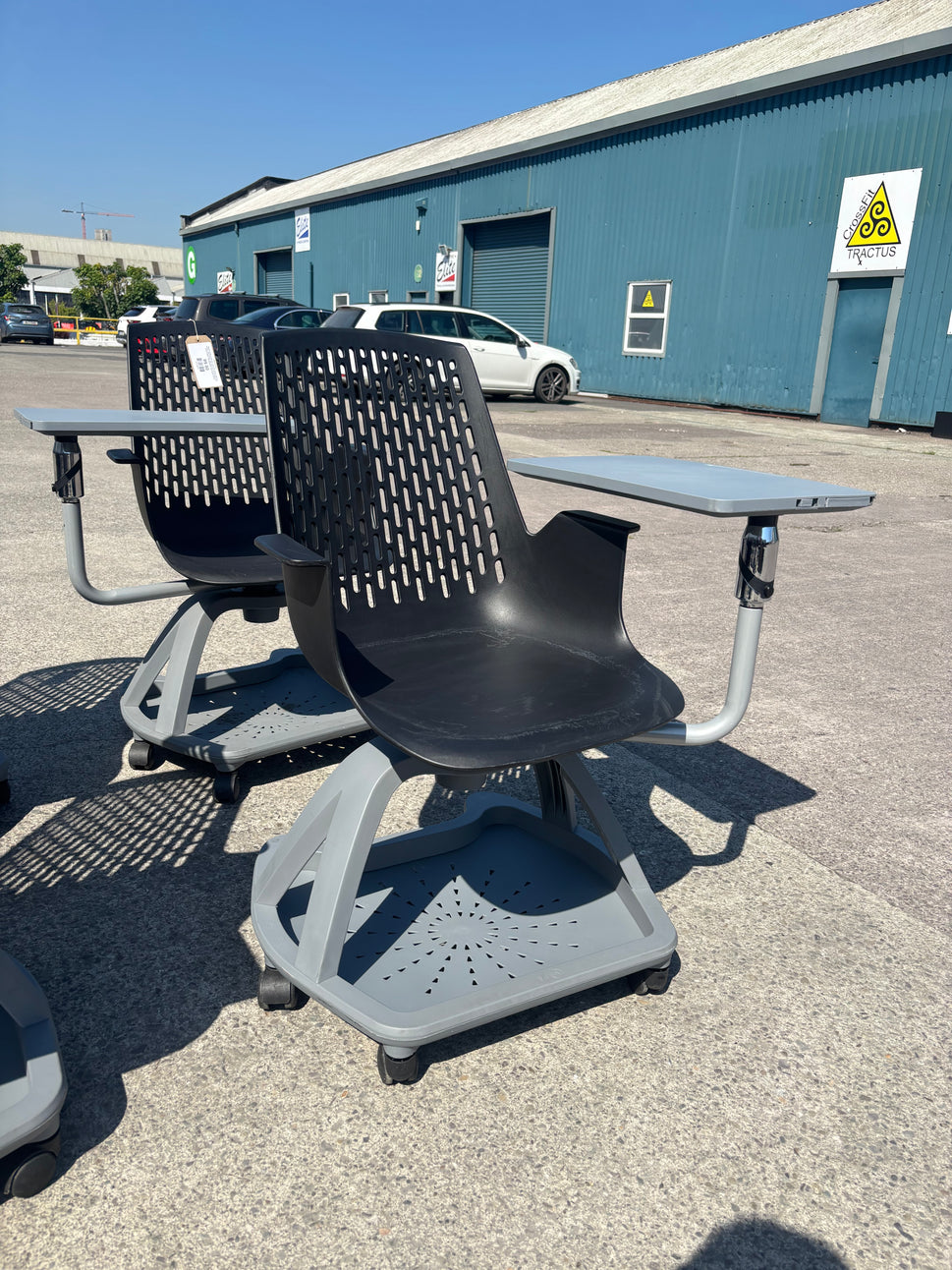 Report mobile conference chair with writing tablet on castors, black plastic seat, dark grey writing tablet with drinks holder. 90Hx64Wx59H. Seat height 445mm