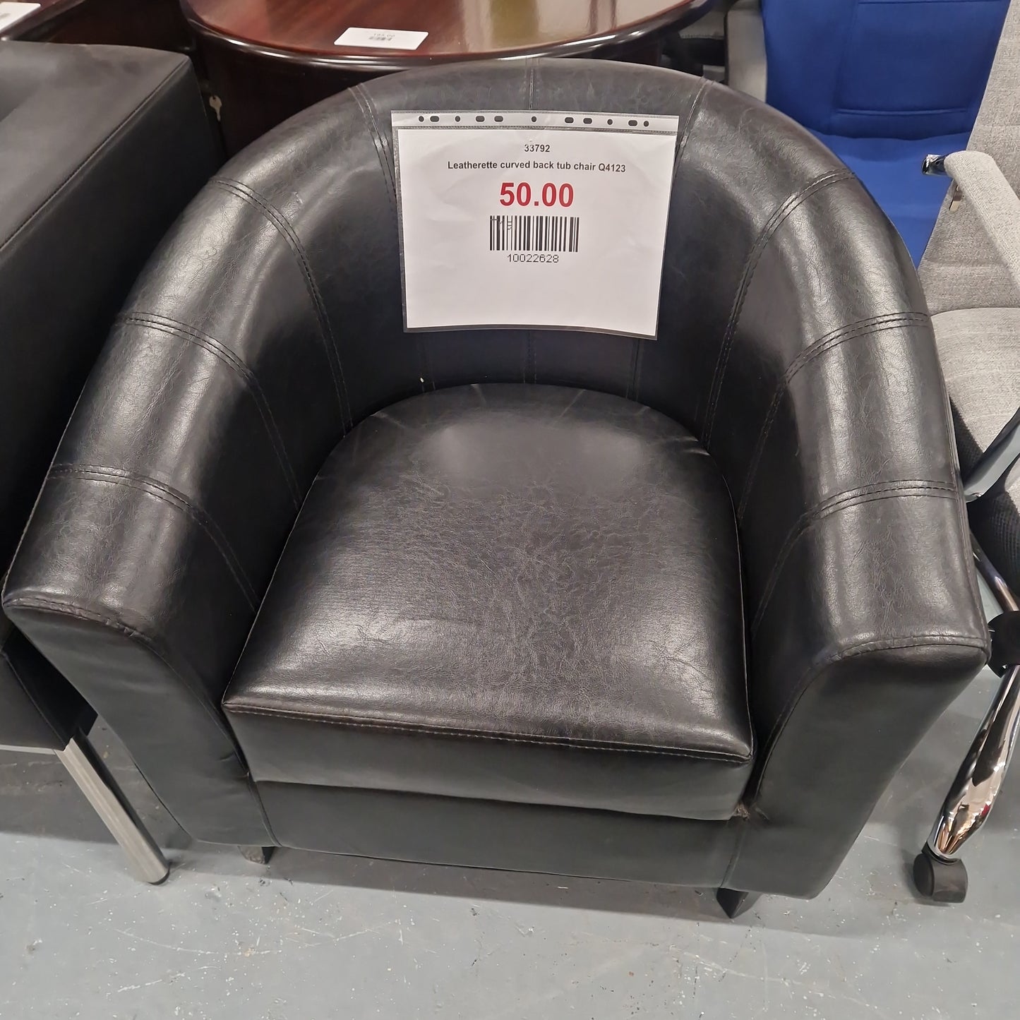 Leatherette curved back tub chair