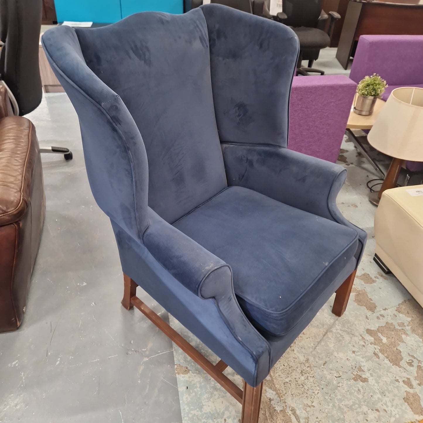 Blue velvet wooden framed armchair