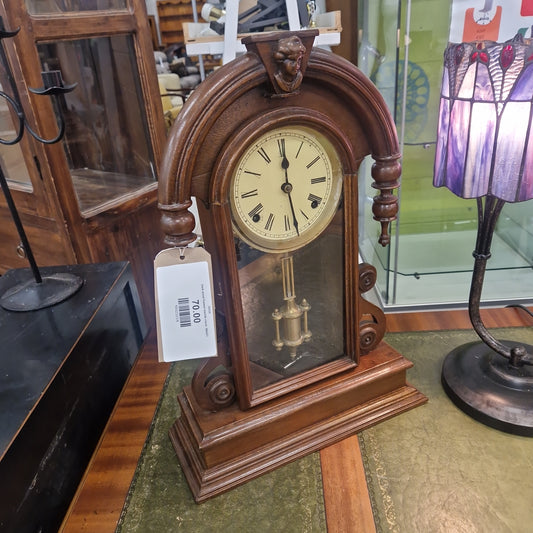 Dark wood framed mantle clock