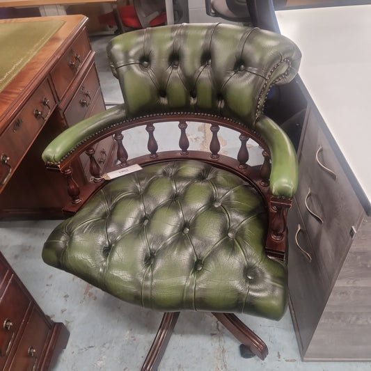 Chesterfield green leather button back swivel captains chair with wooden swivel base and arms
