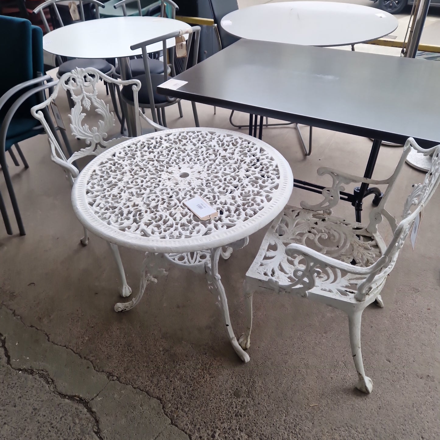 Cast iron outdoor table with 2 no. chairs