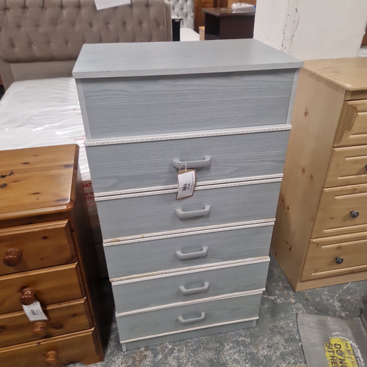 Grey laminate 5 high chest of drawers, edging off on one side