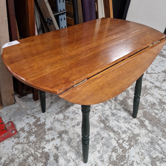 Solid dark wood stained drop leaf kitchen table oval with green painted legs