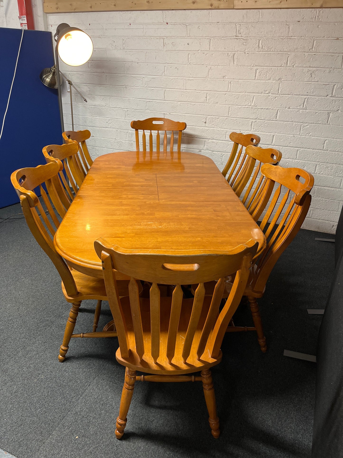 Large hardwood oval extendable dining table (L 155 - 215 x W 105 cm) with 8 no. matching high back solid wood chairs 2225